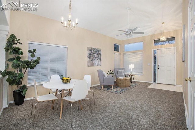 dining area featuring a chandelier, carpet, baseboards, and ceiling fan