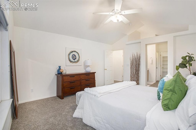 carpeted bedroom featuring lofted ceiling and a ceiling fan