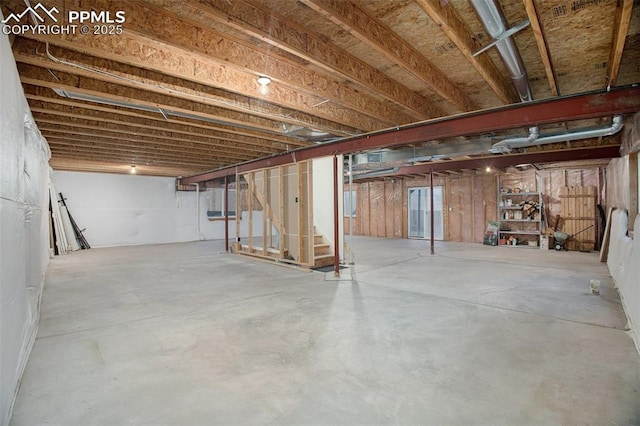 unfinished basement with stairs