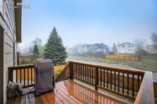 deck featuring a residential view and a fenced backyard