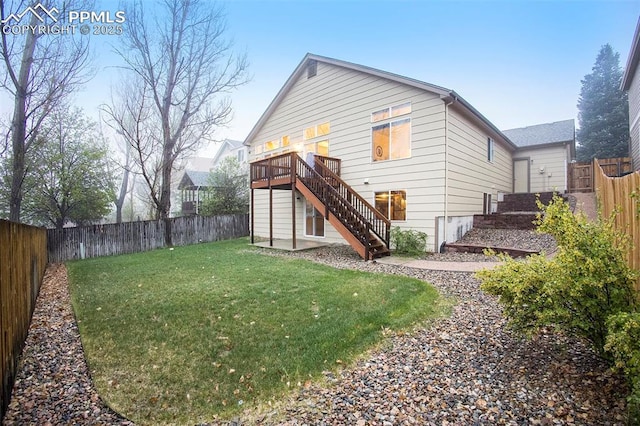 back of property featuring stairway and a wooden deck
