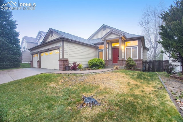 view of front of home with brick siding, concrete driveway, and a garage