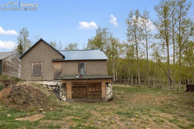 910 Victor Ave, Goldfield, CO 80860 - view of side of home featuring metal roof