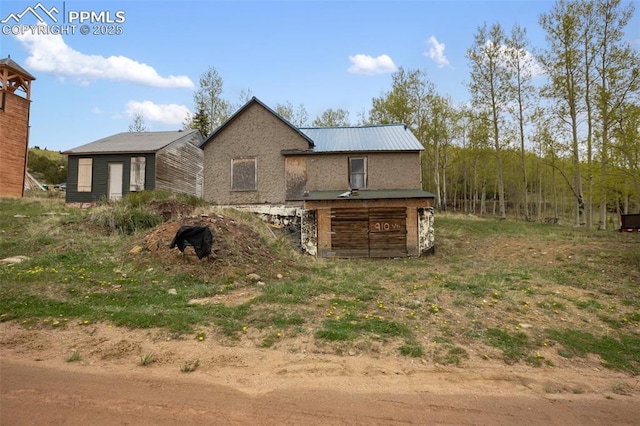 910 Victor Ave, Goldfield, CO 80860 - rear view of property featuring metal roof