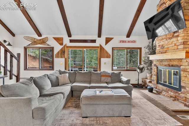 9410 Shoshone Rd, Cascade, CO 80809 - living area featuring a stone fireplace and stairway