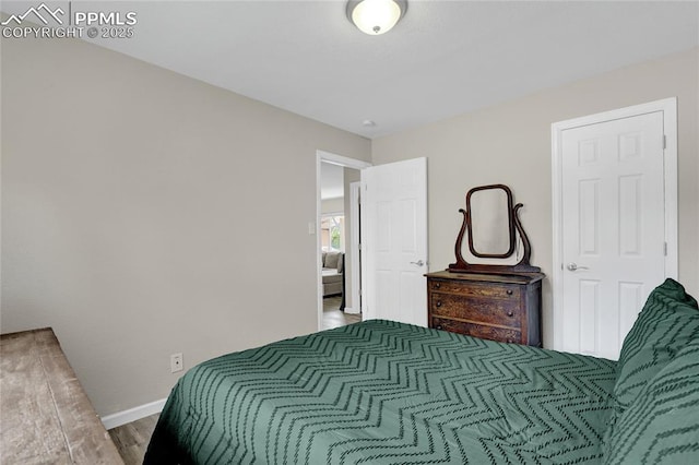 105 Easy St, Colorado Springs, CO 80911 - bedroom featuring baseboards and wood finished floors
