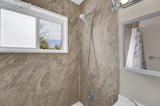 105 Easy St, Colorado Springs, CO 80911 - bathroom with shower / bath combo with shower curtain and a textured wall