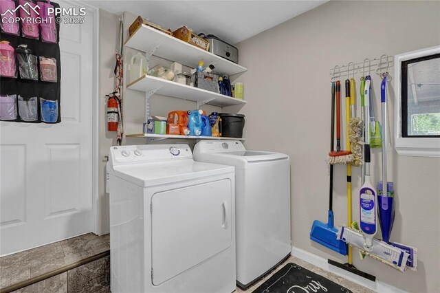 105 Easy St, Colorado Springs, CO 80911 - laundry area featuring washing machine and clothes dryer and baseboards