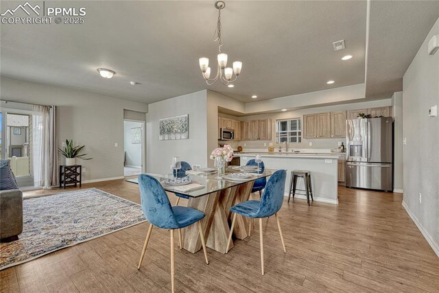 4342 Kaolin Ct, Colorado Springs, CO 80938 - dining space featuring a chandelier, light wood finished floors, and recessed lighting