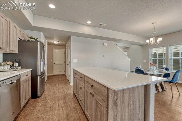 4342 Kaolin Ct, Colorado Springs, CO 80938 - kitchen featuring dishwasher, light wood-style floors, a center island, a chandelier, and recessed lighting