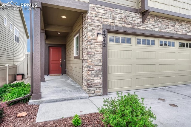 4342 Kaolin Ct, Colorado Springs, CO 80938 - entrance to property featuring stone siding and driveway