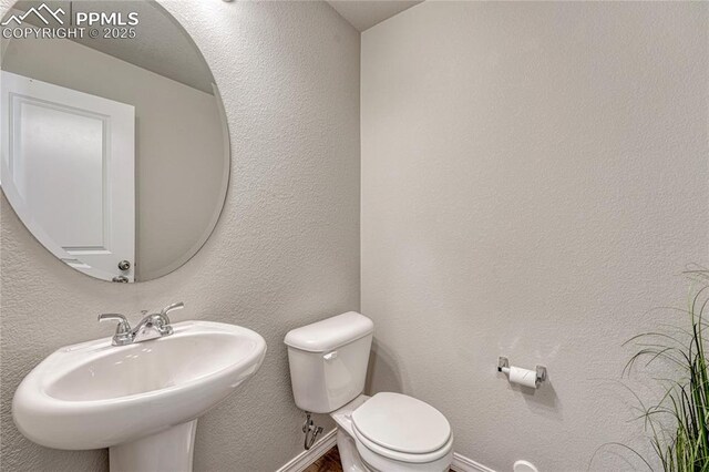 4342 Kaolin Ct, Colorado Springs, CO 80938 - half bathroom with a sink and toilet