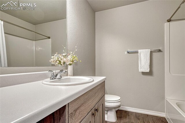 4342 Kaolin Ct, Colorado Springs, CO 80938 - bathroom with wood finished floors, vanity, and tub / shower combination