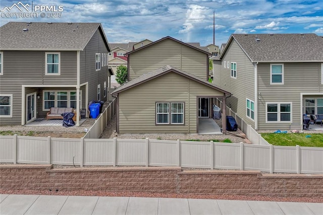 4342 Kaolin Ct, Colorado Springs, CO 80938 - back of house with a patio area, a fenced backyard, and a residential view