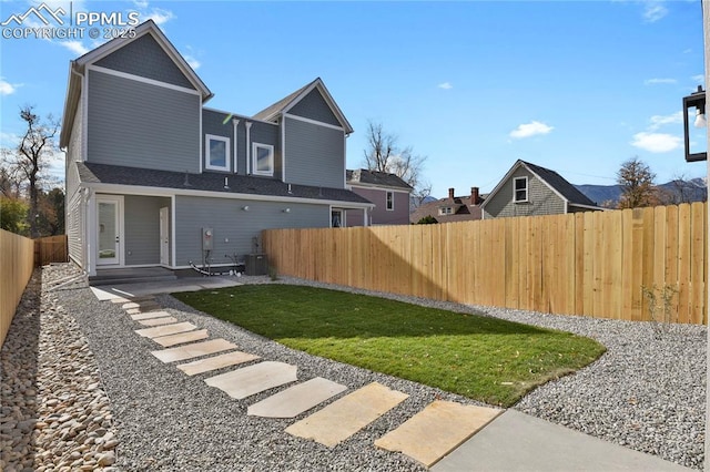 view of yard featuring central AC unit and a patio area