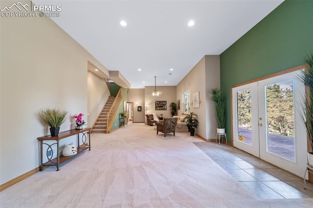 8174 Inca Rd, Larkspur, CO 80118 - entryway with carpet flooring, stairway, plenty of natural light, french doors, and recessed lighting
