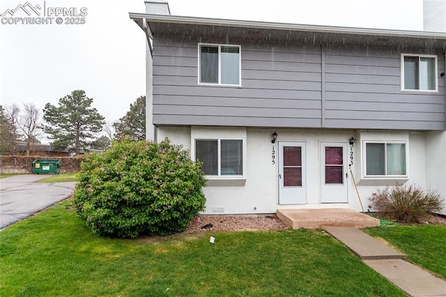 1295 Soaring Eagle Dr, Colorado Springs, CO 80915 - view of front of house with a front lawn and stucco siding