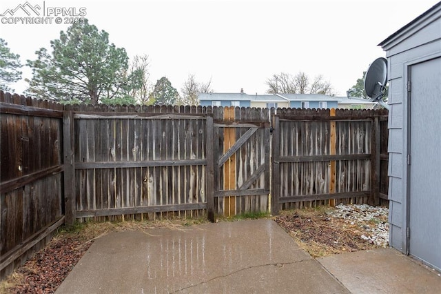 1295 Soaring Eagle Dr, Colorado Springs, CO 80915 - gate with fence and a patio area