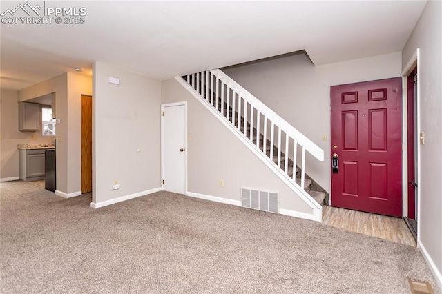1295 Soaring Eagle Dr, Colorado Springs, CO 80915 - foyer entrance with stairway, carpet flooring, and baseboards