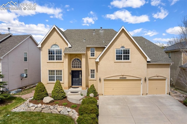 11985 Hanging Valley Way, Colorado Springs, CO 80921 - traditional-style house featuring stucco siding, driveway, and a garage