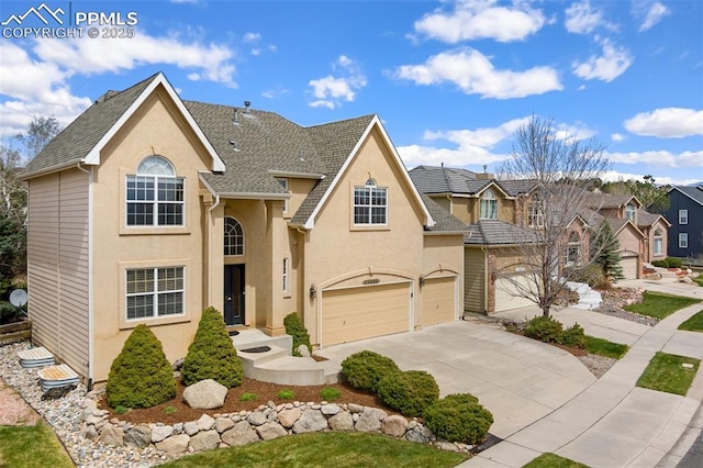 11985 Hanging Valley Way, Colorado Springs, CO 80921 - traditional-style home with driveway, stucco siding, a garage, and roof with shingles