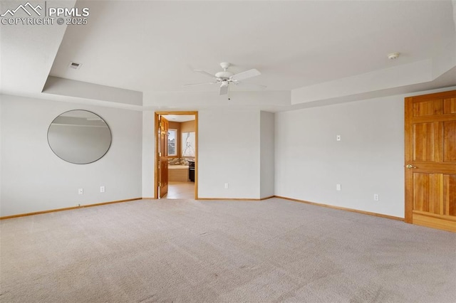 11985 Hanging Valley Way, Colorado Springs, CO 80921 - carpeted empty room featuring a tray ceiling, baseboards, and a ceiling fan