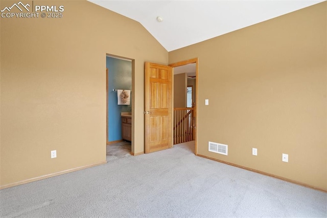 11985 Hanging Valley Way, Colorado Springs, CO 80921 - spare room featuring carpet flooring, lofted ceiling, and baseboards