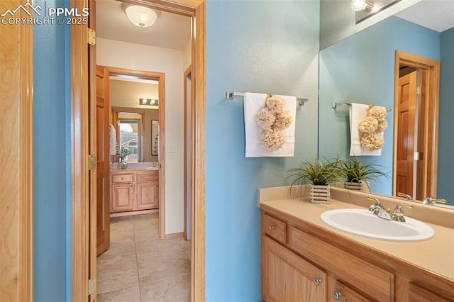 11985 Hanging Valley Way, Colorado Springs, CO 80921 - bathroom featuring vanity and tile patterned flooring