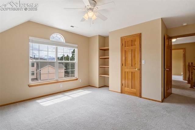 11985 Hanging Valley Way, Colorado Springs, CO 80921 - unfurnished bedroom with carpet, baseboards, and lofted ceiling