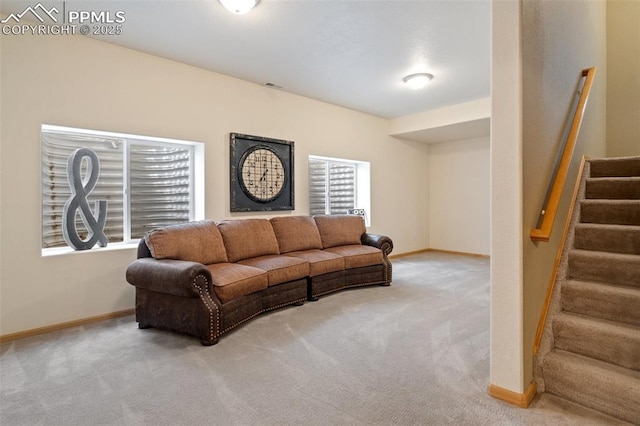 11985 Hanging Valley Way, Colorado Springs, CO 80921 - carpeted living room with stairs and baseboards
