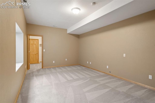 11985 Hanging Valley Way, Colorado Springs, CO 80921 - empty room with light colored carpet, baseboards, and a smoke detector