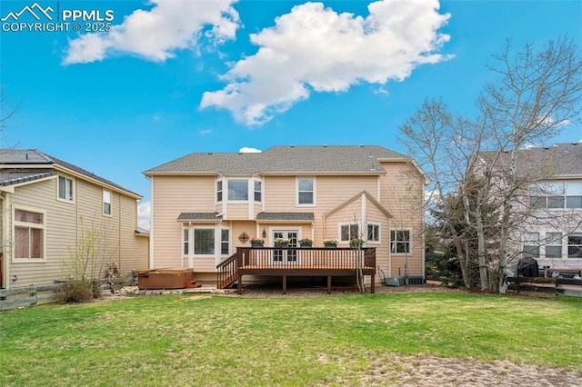 11985 Hanging Valley Way, Colorado Springs, CO 80921 - rear view of house featuring a hot tub, a wooden deck, and a yard