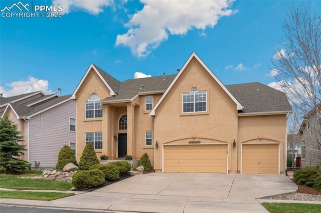 11985 Hanging Valley Way, Colorado Springs, CO 80921 - traditional-style home with driveway, stucco siding, and a garage
