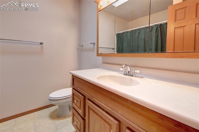 770 Allegheny Dr, Colorado Springs, CO 80919 - full bath with vanity, toilet, baseboards, and a shower with shower curtain