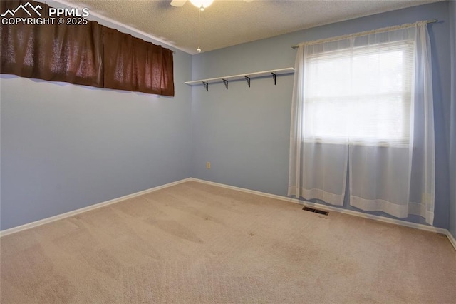 770 Allegheny Dr, Colorado Springs, CO 80919 - carpeted empty room with baseboards and a textured ceiling