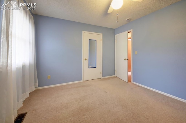 770 Allegheny Dr, Colorado Springs, CO 80919 - unfurnished room featuring carpet flooring, ceiling fan, baseboards, and a textured ceiling