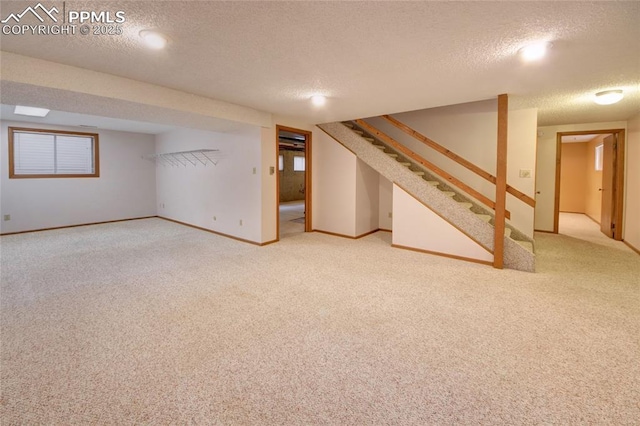 770 Allegheny Dr, Colorado Springs, CO 80919 - finished basement featuring carpet floors, a textured ceiling, stairs, and baseboards