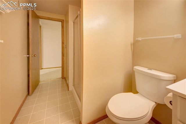 770 Allegheny Dr, Colorado Springs, CO 80919 - full bathroom featuring toilet, a stall shower, vanity, baseboards, and tile patterned floors