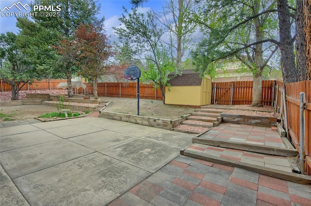 770 Allegheny Dr, Colorado Springs, CO 80919 - view of patio / terrace with a storage unit, a fenced backyard, and an outdoor structure