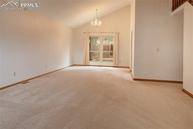 770 Allegheny Dr, Colorado Springs, CO 80919 - empty room with carpet flooring, a chandelier, baseboards, and high vaulted ceiling