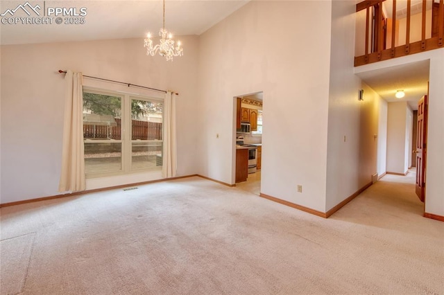 770 Allegheny Dr, Colorado Springs, CO 80919 - unfurnished room featuring light colored carpet, a chandelier, baseboards, and high vaulted ceiling
