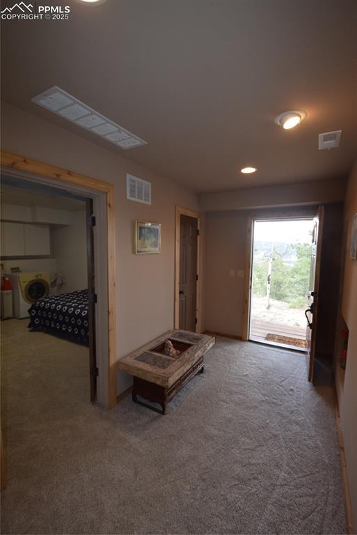 78 Powderhorn Ln, Florissant, CO 80816 - hallway with carpet floors, washer and clothes dryer, and recessed lighting