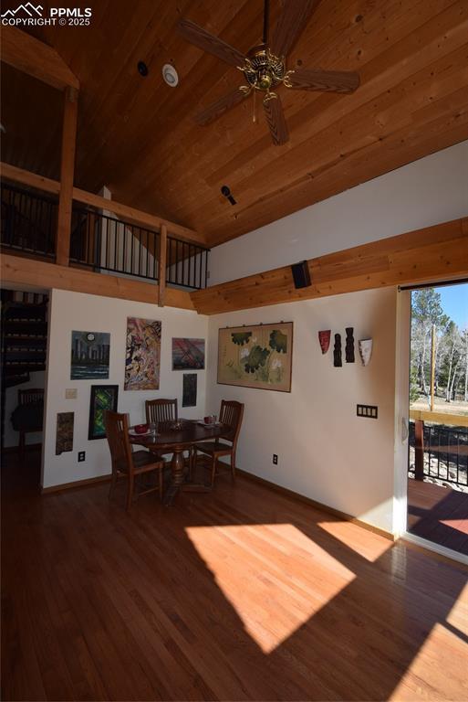 78 Powderhorn Ln, Florissant, CO 80816 - dining space with wood ceiling, wood finished floors, a ceiling fan, baseboards, and high vaulted ceiling