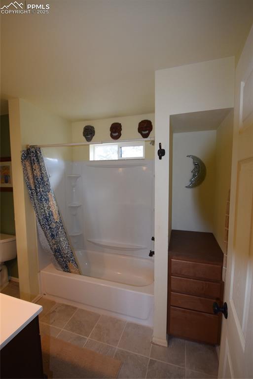 78 Powderhorn Ln, Florissant, CO 80816 - bathroom featuring shower / bath combo with shower curtain and vanity
