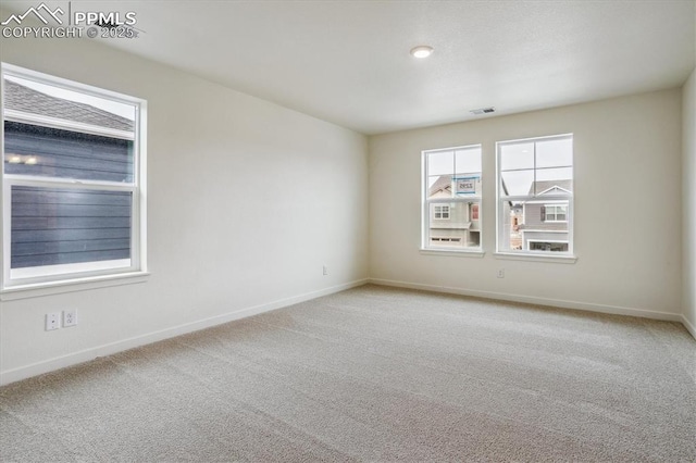 6745 Raven Ridge Ter, Colorado Springs, CO 80925 - unfurnished room featuring baseboards, visible vents, and carpet