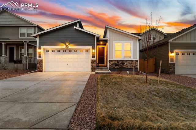 8093 Yellowleaf Pl, Colorado Springs, CO 80908 - view of front facade with concrete driveway, stone siding, and a garage