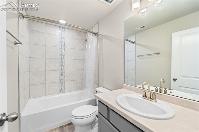 8093 Yellowleaf Pl, Colorado Springs, CO 80908 - bathroom featuring toilet, wood finished floors, shower / bath combo, visible vents, and vanity