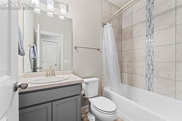 8093 Yellowleaf Pl, Colorado Springs, CO 80908 - bathroom featuring toilet, shower / tub combo with curtain, vanity, and a textured wall