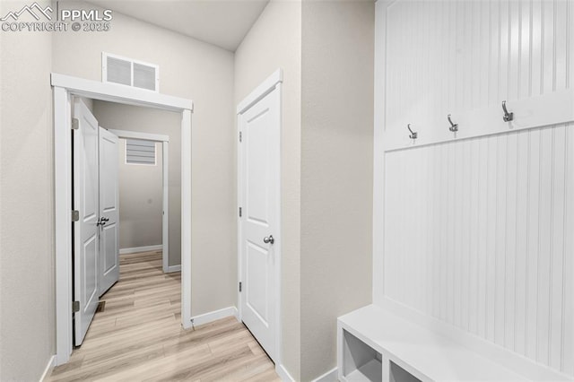 8093 Yellowleaf Pl, Colorado Springs, CO 80908 - mudroom with baseboards, visible vents, and light wood-style floors