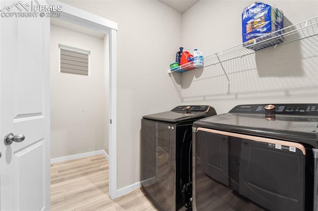 8093 Yellowleaf Pl, Colorado Springs, CO 80908 - clothes washing area featuring baseboards, light wood-style flooring, laundry area, and washer and dryer